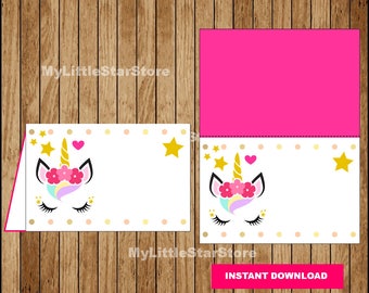 May include: Printable unicorn place card template with a pink background and a unicorn face with a rainbow mane and a flower crown. The text "MyLittleStarStore" appears on the card. The text "INSTANT DOWNLOAD" appears in a pink box at the bottom of the card.