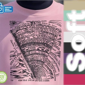 May include: A light pink t-shirt featuring a detailed black and white illustration of a map-like diagram with text. The text includes "Centro Dela Terra" and "Profondita-M". The shirt also has a "Support Small Business" and "Responsibly Made" logo.