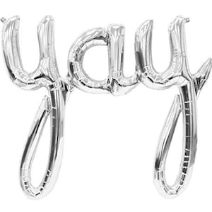 May include: Silver foil balloon spelling out the word "yay" in a cursive font.