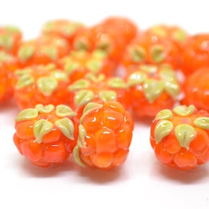 Set of Seven Handmade Glass Fruit Beads Including a Pear and a Strawberry  and a Lemon and a Lime and a Peach — The Glass Studio