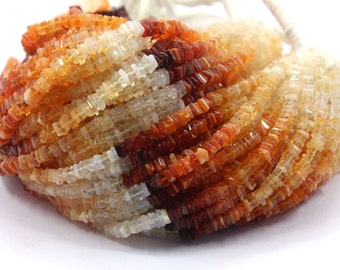 May include: A strand of orange, yellow, and white gemstone beads. The beads are square shaped and have a faceted finish.
