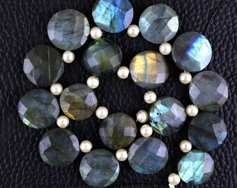 May include: A strand of round, faceted labradorite beads in shades of blue, green, and gold, interspersed with white pearl beads.