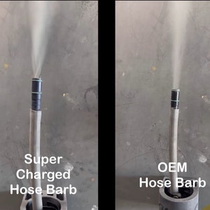 May include: Side-by-side comparison of two hose barbs. The left barb is labeled "Super Charged Hose Barb" and the right barb is labeled "OEM Hose Barb". Both barbs are emitting a white smoke plume.