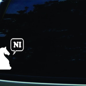 May include: A white silhouette of a chess knight with a speech bubble that says "NI" on a black background.