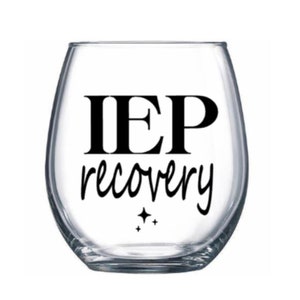 May include: A clear glass wine glass with the text "IEP recovery" printed on it in black.