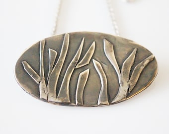 Collar de flor de plata