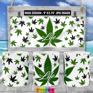 May include: Three white ceramic mugs featuring a green and black marijuana leaf pattern with the word "Life" printed on them. The mugs are displayed on a wooden surface with a sign reading "Mug Design - 9" x 3.75" JPG Image".