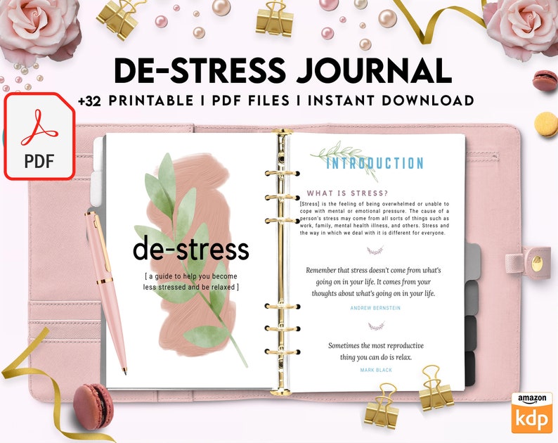 May include: A pink and white journal with the title "De-Stress Journal" and the text "+32 Printable I PDF Files I Instant Download". The journal has a green leaf design and the words "de-stress" in a pink and white font. The journal is open to a page with the title "Introduction" and the text "What is Stress?" and "Remember that stress doesn't come from what's going on in your life. It comes from your thoughts about what's going on in your life."
