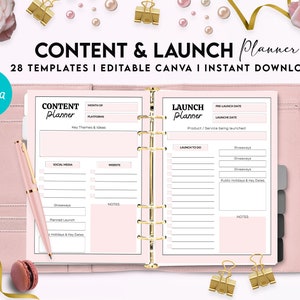 May include: A pink planner binder containing open pages with Content Planner and Launch Planner templates. The pages feature sections for dates, platforms, themes, and checklists. A matching pink pen rests on the left page, and gold binder clips are placed around the planner.