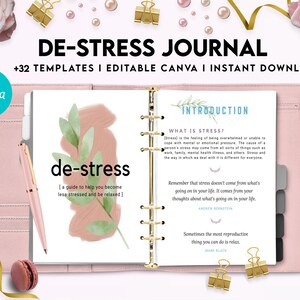 May include: A pink and white journal with the title "De-Stress Journal" and the text "+32 Templates | Editable Canva | Instant Download". The journal has a gold spiral binding and a floral design on the cover. The journal is open to a page with the title "Introduction" and the text "What is Stress?" and "Remember that stress doesn't come from what's going on in your life. It comes from your thoughts about what's going on in your life."