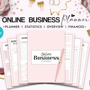 May include: A light pink online business planner with a matching pink pen resting on the cover. The planner includes multiple pages with sections for statistics, overview, and finances. The text on the cover reads Online Business Planner.