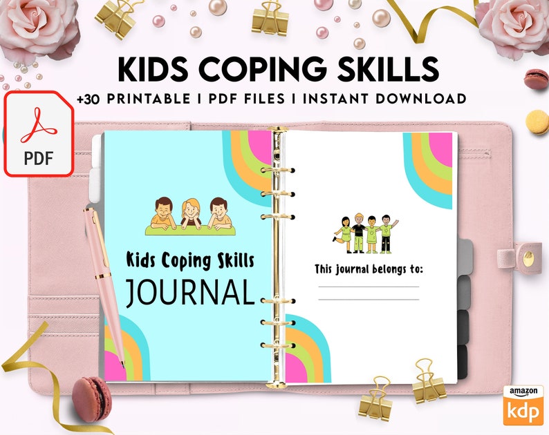 May include: A pink binder with a colorful journal inside. The journal cover features a rainbow design and the text "Kids Coping Skills JOURNAL".