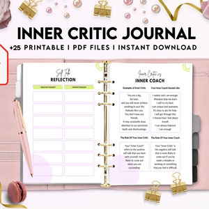 May include: A pink and white printable journal with the title "Inner Critic Journal" and the text "Self Talk Reflection" and "Inner Critic vs Inner Coach". The journal has a ring binder and is designed to help users identify and challenge negative self-talk.