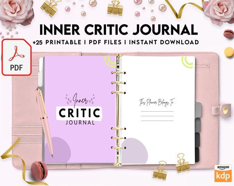 May include: A pink and white journal with the text "Inner Critic Journal" on the cover. The journal has a gold spiral binding and is open to a page with the text "This Planner Belongs To".