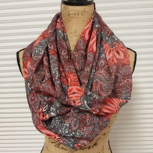 Beautiful silky oversized infinity scarf with red pink and gray detail