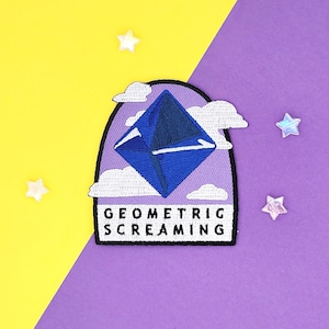 May include: Purple and blue embroidered patch featuring a geometric diamond shape in the centre, surrounded by white clouds. The text "Geometric Screaming" is below the diamond.