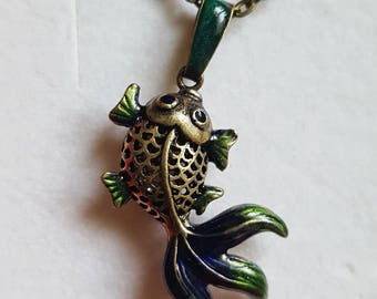 Fish blue and green hand enamelled brass pendant on a brass chain .