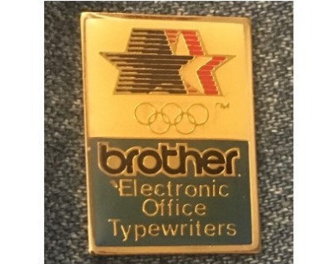 Brother Olympic Sponsor Pin ~ Electronic Office Typewriters ~ 1984 Los Angeles with Stars in Motion