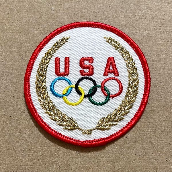 1980er Vintage Olympia USA Aufnäher zum Aufnähen ~ 5 Ringe Logo mit Gold Olivenkranz ~ Kotinos