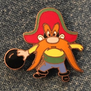 May include: A cartoon character wearing a red and green hat and a yellow shirt is bowling. The character has a long orange beard and moustache. The bowling ball is black.