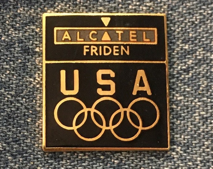 Friden-Alcatel Olympic Pin ~ 1988 Calgary & Seoul Games ~ USA Team Sponsor ~ Black