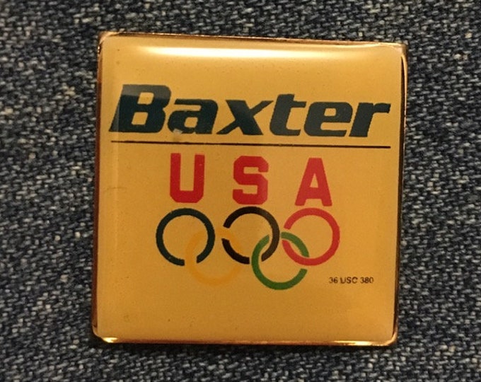 Olympic Pin ~ undated from 1992 Albertville & Barcelona Games ~ USA Team Sponsor ~ Baxter ~ Domed Enamel