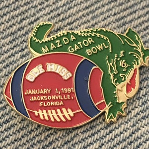 1991 Gator Bowl Pin ~ Ole Miss ~  NCAA ~ College Football ~ Sponsor ~ Mazda ~ Auto~Car
