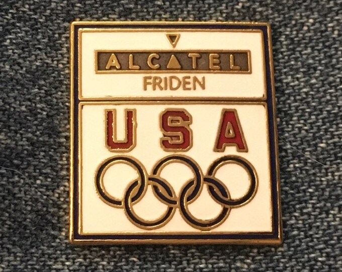 Friden-Alcatel Olympic Pin ~ 1988 Calgary & Seoul Games ~ USA Team Sponsor ~ White