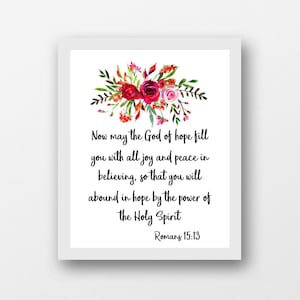 May include: A watercolor floral design with red and pink flowers and green leaves. The text reads "Now may the God of hope fill you with all joy and peace in believing, so that you will abound in hope by the power of the Holy Spirit Romans 15:13".
