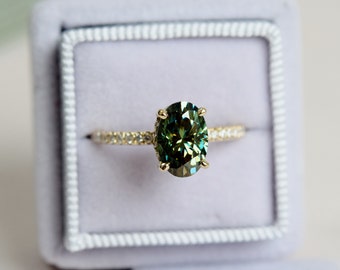 Olive green moissanite ring. Forever one moissanite engagement ring. Oval engagement ring. Yellow gold engagement ring. Gemstone ring