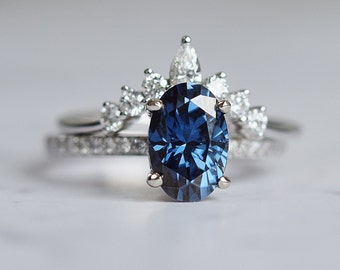 Montana Blue moissanite engagement ring. Affordable engagement ring. Classic oval engagement ring. Blue sapphire alternative engagement ring