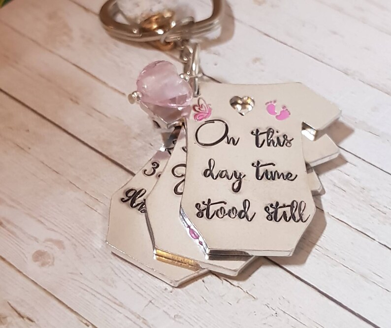 Baby birth announcement keyring .