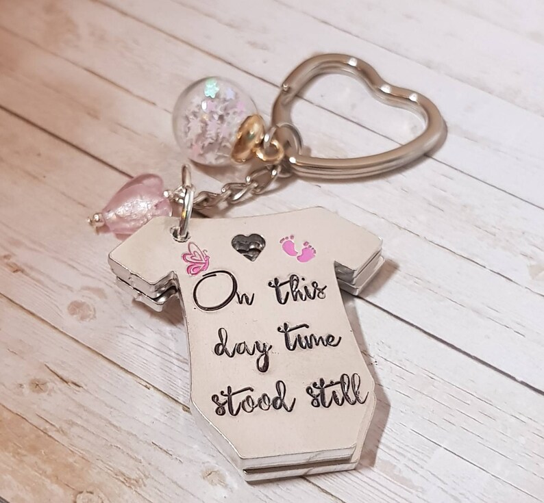 Baby birth announcement keyring .