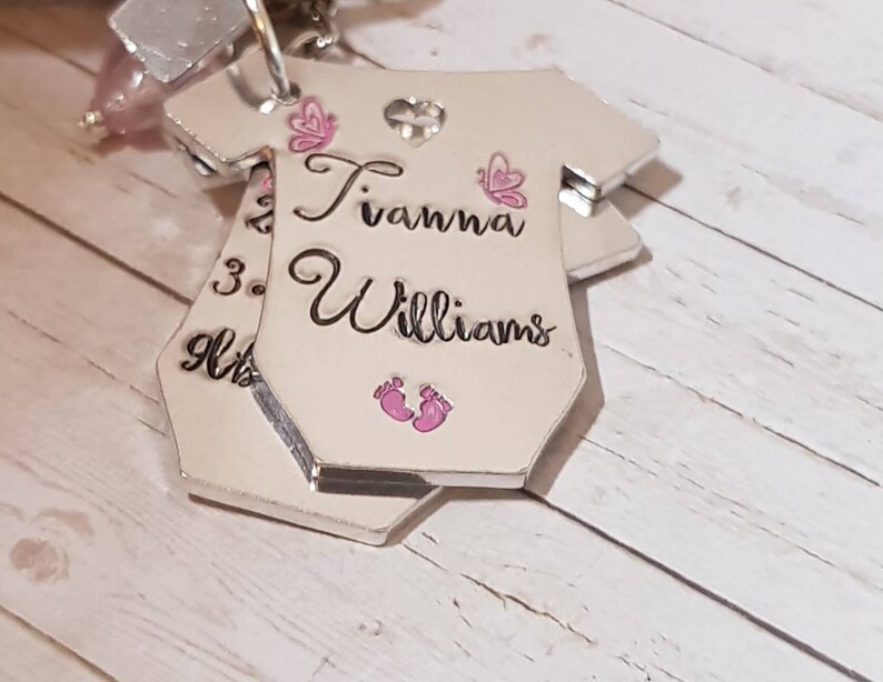 Baby birth announcement keyring .