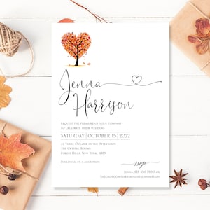 May include: Wedding invitation with a fall theme. The invitation features a heart-shaped tree with orange, red, and yellow leaves. The text on the invitation reads "Jenna Harrison" and includes the date and time of the wedding. The RSVP information is also included.