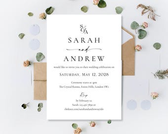 May include: A white wedding invitation with black text, featuring the names "Sarah and Andrew" in elegant script. The invitation includes the wedding date, time, and location. The invitation is surrounded by decorative elements, including dried flowers and greenery.