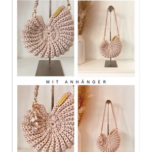 May include: A light beige crochet handbag with a shell-like spiral design and a matching braided strap. The bag features a small rectangular label and is shown in two versions: one without a charm and one with a dangling pearl-style charm.