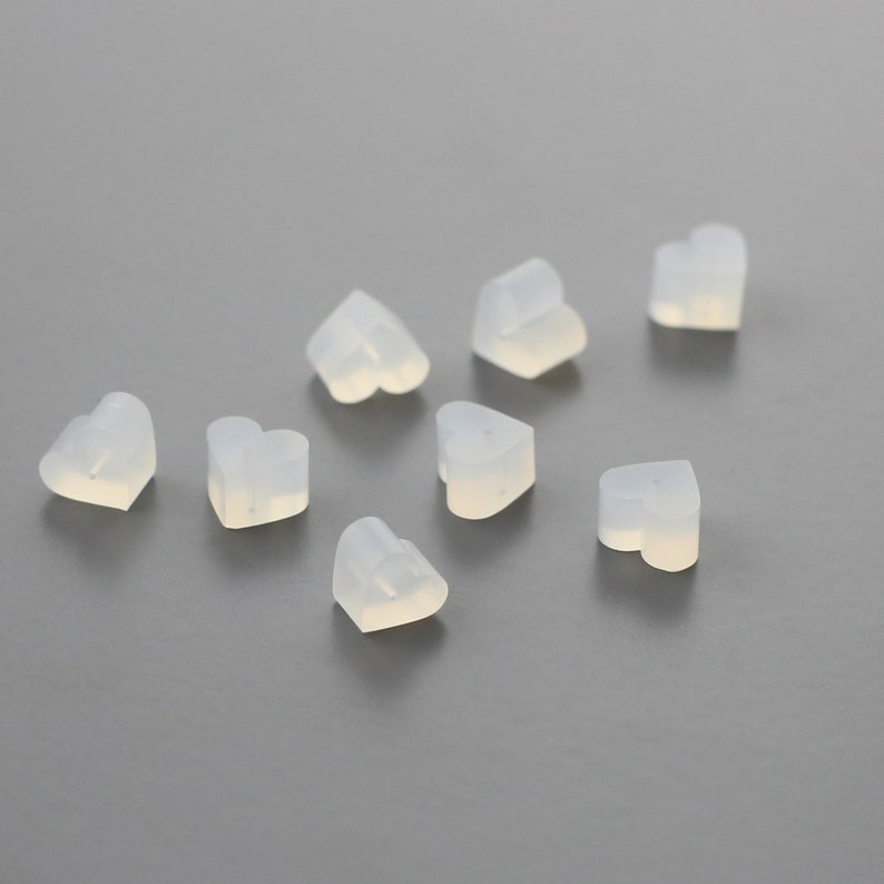 May include: Eight small, translucent, heart-shaped silicone earplugs.