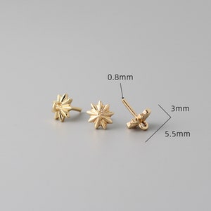 May include: Gold-toned star-shaped earring findings with a 0.8 mm post and a 5.5 mm diameter. The findings are 3 mm in height.