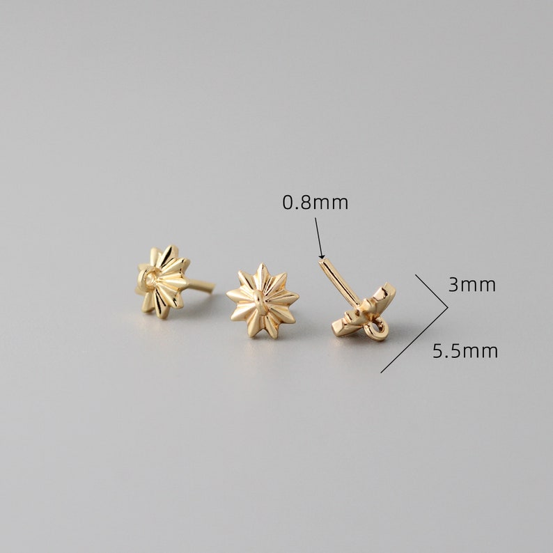 May include: Gold-toned star-shaped earring findings with a 0.8 mm post and a 5.5 mm diameter. The findings are 3 mm in height.