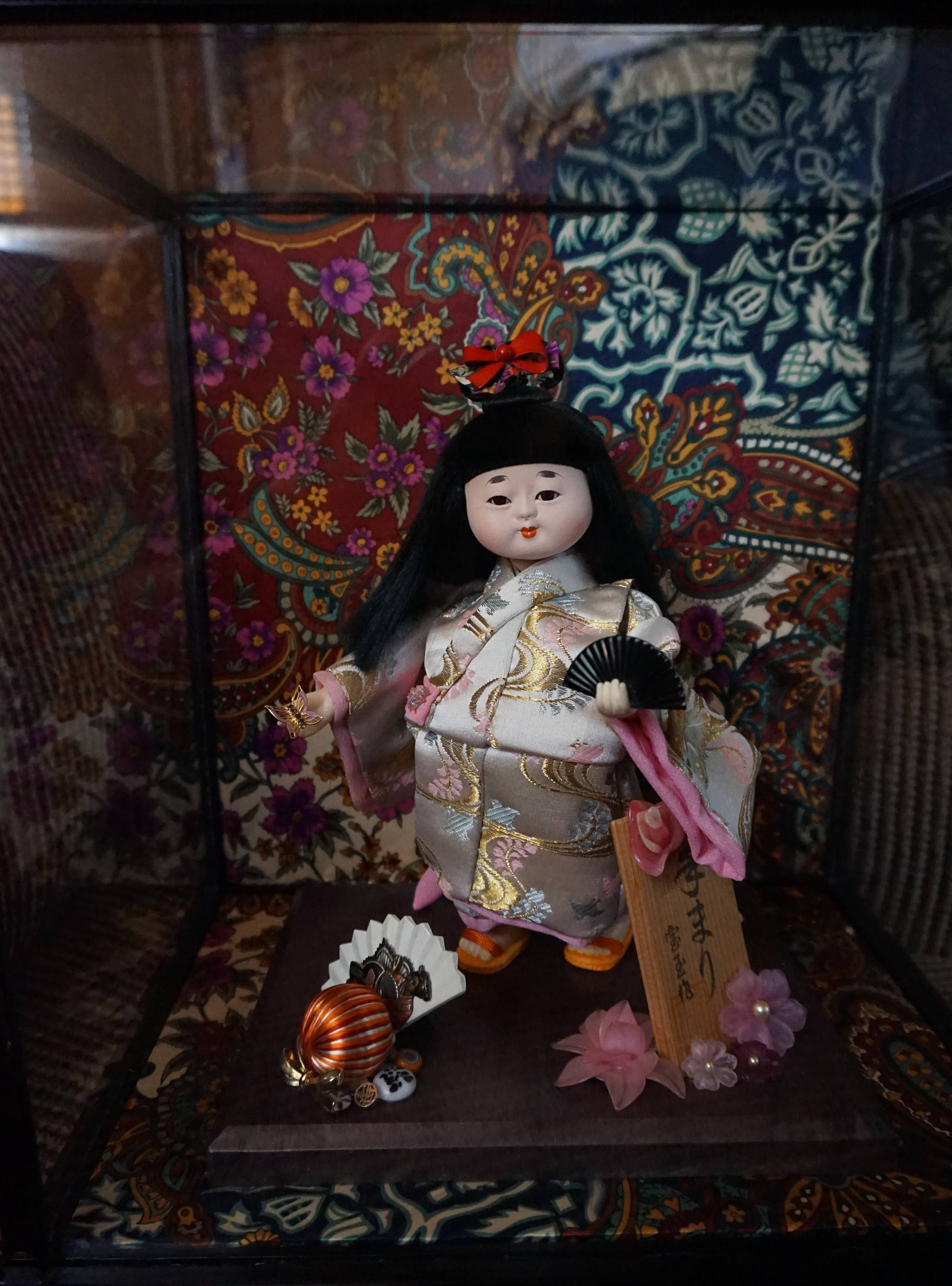 oriental dolls in glass cases