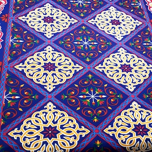 Indigo African fabric with Egyptian traditional patterns including arabesques and lotus flowers for decorative making. Sold by half a meter