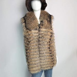 May include: A brown fur vest with a large collar and a brown fur hat. The vest is made of long, thin strips of fur that are sewn together in a horizontal pattern.
