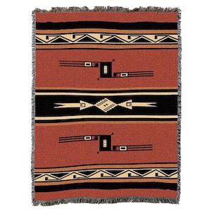 May include: A woven throw blanket with a Southwestern design featuring black, red and beige geometric patterns. The blanket has a fringed edge.
