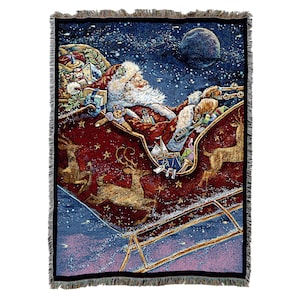 May include: A tapestry featuring a red and gold sleigh with Santa Claus and reindeer flying through a starry night sky. The sleigh is filled with presents and toys. A full moon is visible in the background.