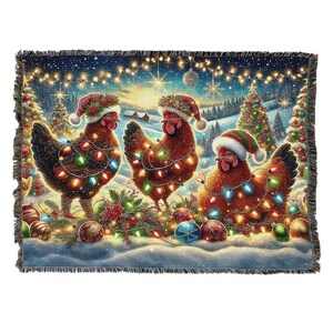 May include: A rectangular woven throw blanket featuring three brown chickens wearing red and green Santa hats. The chickens are wrapped in colorful glowing Christmas lights. The background shows a snowy landscape with decorated pine trees.