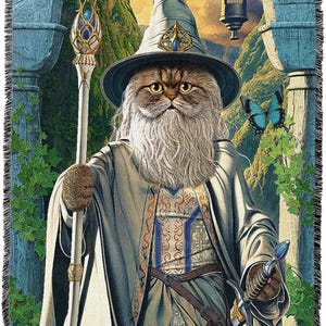 May include: Woven tapestry throw blanket featuring a cat dressed as a wizard, complete with a hat, staff, and sword. The cat has a long white beard and is set against a fantasy landscape with a blue butterfly.