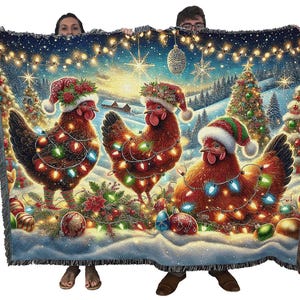 May include: A woven throw blanket featuring three brown chickens wearing Santa hats and wrapped in colorful Christmas lights. The scene includes decorated pine trees, snow-covered ground, hanging string lights, and ornaments against a winter landscape.
