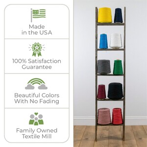 May include: A wooden ladder shelf with eight spools of yarn in various colors, including yellow, blue, white, gray, green, red, and pink. The shelf is made in the USA and has a 100% satisfaction guarantee. The yarn is made with beautiful colors that do not fade.