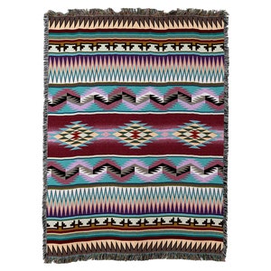 May include: A woven throw blanket with a Southwestern-inspired geometric pattern in shades of red, blue, green, and brown. The blanket has a fringed edge.